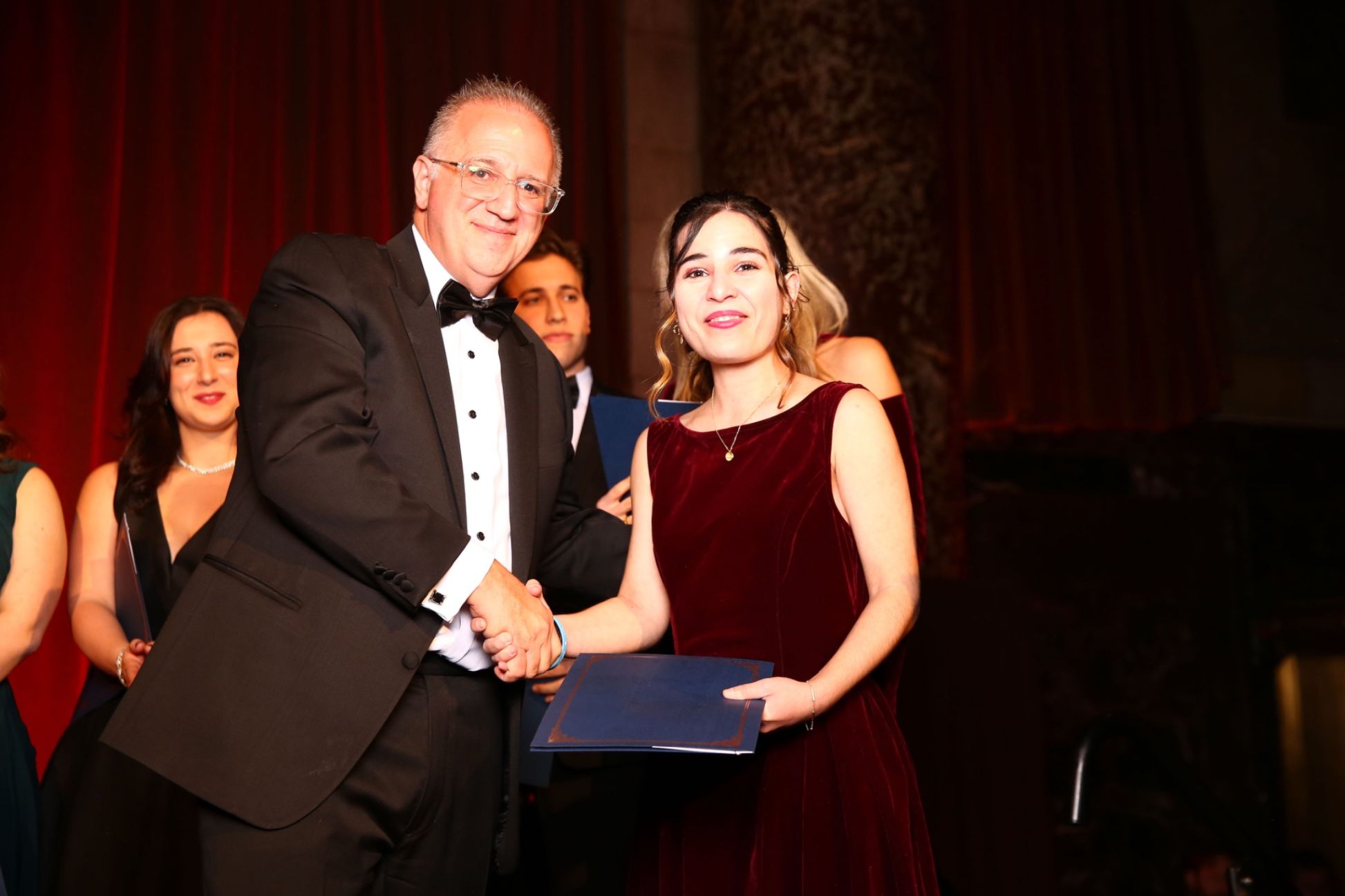 HMS President Dr. Antonios P. Gasparis congratulates a scholarship recipient at the 89th Annual Scholarship Gala